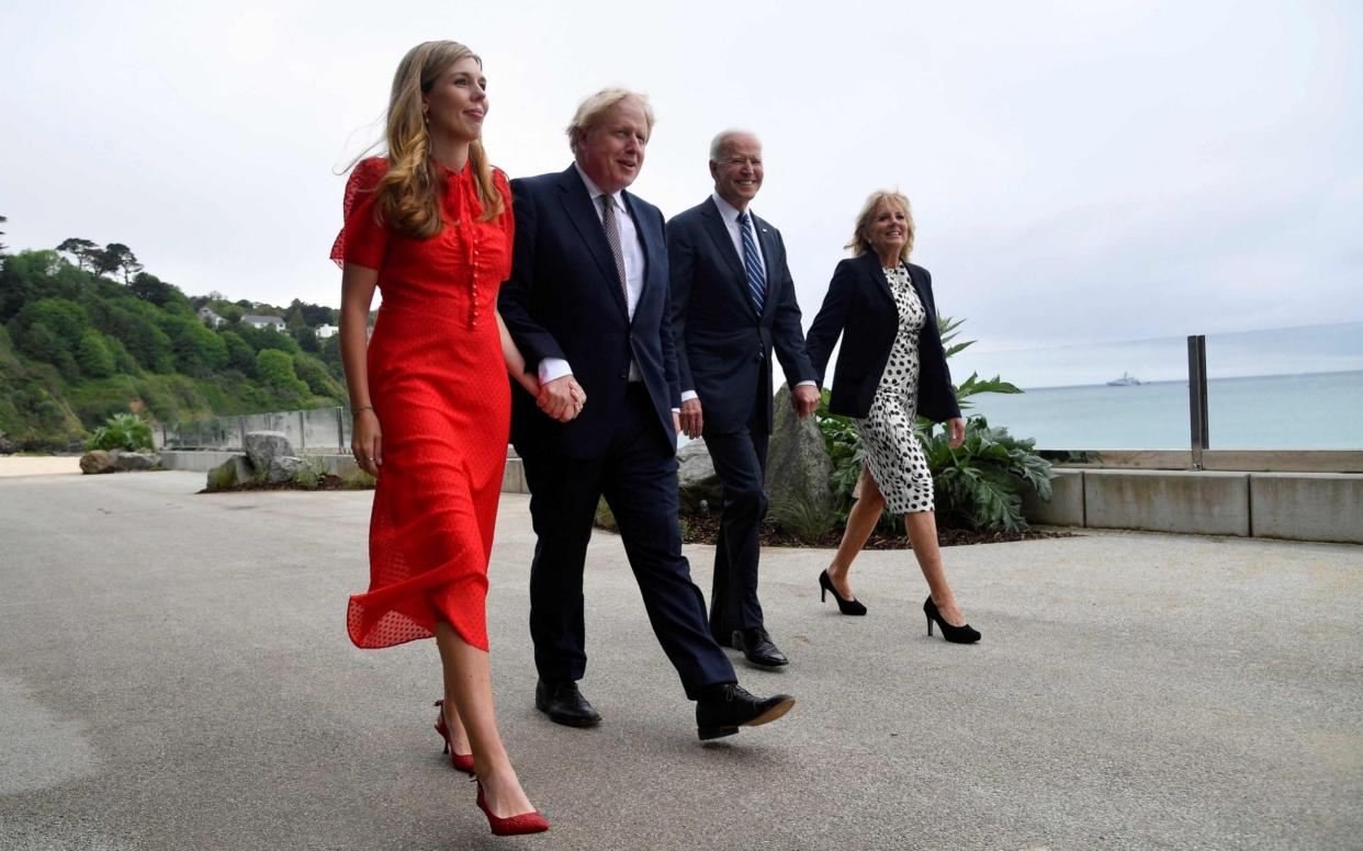 Carrie and Boris Johnson walk with Joe and Jill Biden in Cornwall, ahead of the three-day G7 summit - Toby Melville/AFP