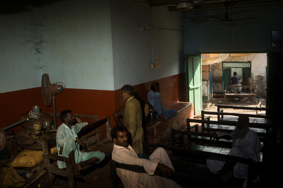 An establishment frequented by the remaining residents of Rajo Nizamani where they gather to watch news while waiting for the flood water to clear, Sept. 10.<span class="copyright">Hassaan Gondal for TIME</span>