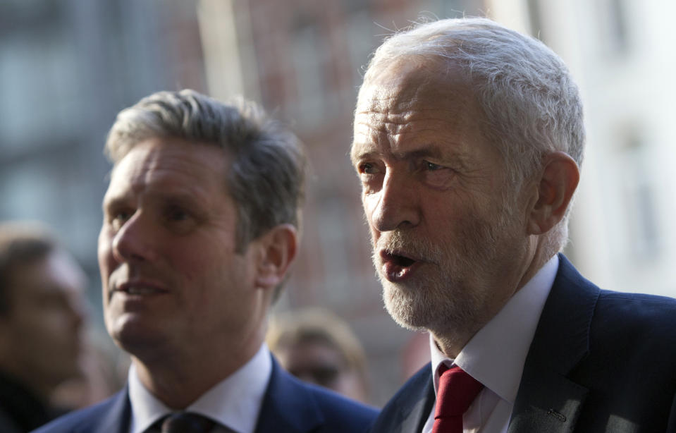 British Labour Party leader Jeremy Corbyn, right, speaks with the media outside EU headquarters in Brussels, Thursday, Feb. 21, 2019. Corbyn is in Brussels to meet European Union chief Brexit negotiator Michel Barnier. (AP Photo/Virginia Mayo)