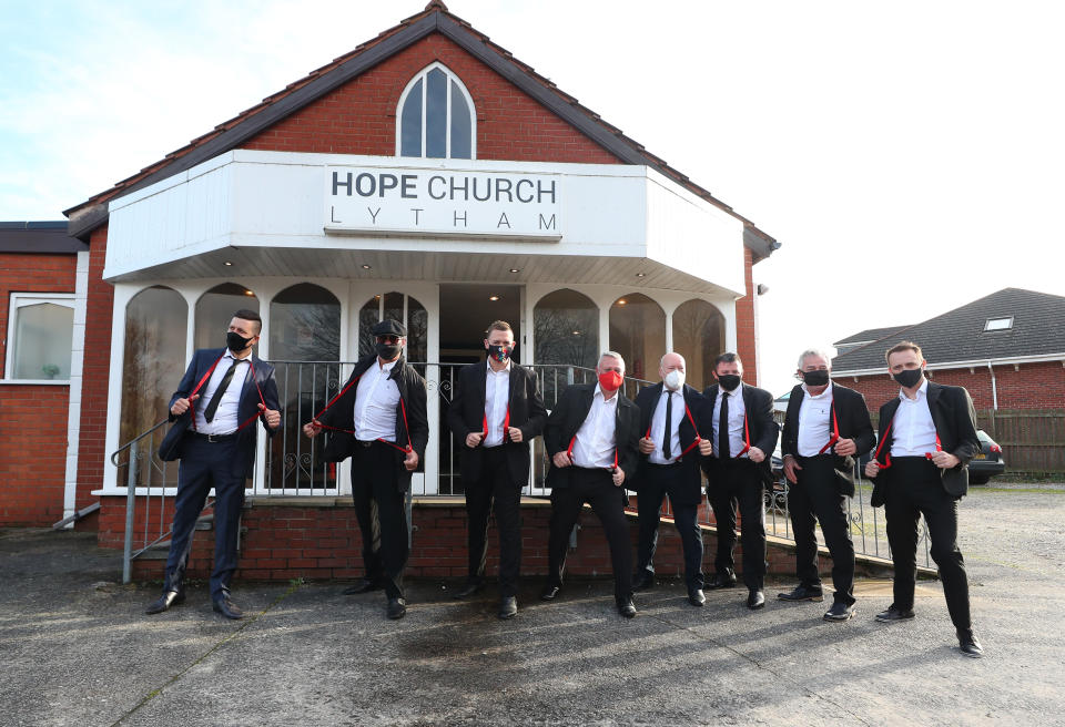 Mourners wearing red braces in honour of comedian Bobby Ball outside Hope Church in Lytham Saint Annes, Lancashire, ahead of the entertainer's funeral. (Photo by Peter Byrne/PA Images via Getty Images)