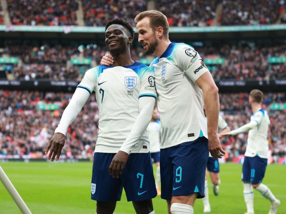 Bukayo Saka celebrates with England captain Harry Kane (The FA via Getty Images)