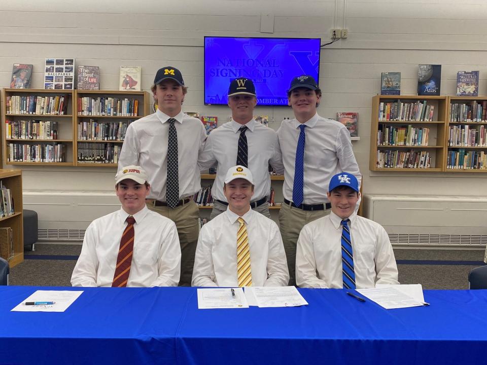 St. Xavier High School celebrated the first of four National Signing Days Nov. 9, 2022, honoring its seniors who will play college athletics. They are, from left: front, Luca Eckert, swimming, IUPUI; Drew Evans, tennis, Western Michigan; Gavin Hang, diving, University of Kentucky; back, Max Bonner, lacrosse, University of Michigan; Brennan Hileman, baseball, Wofford College and Nicholas Stroh, swimming, Xavier University.