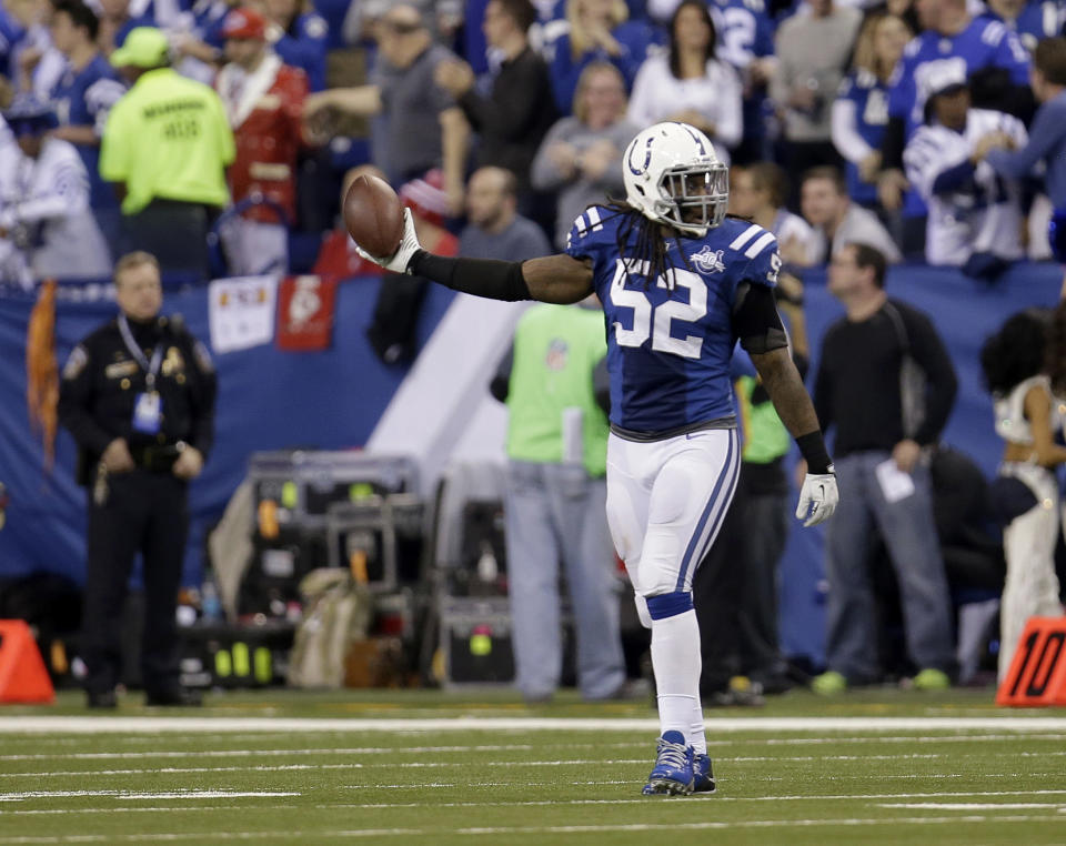 Indianapolis Colts' Kelvin Sheppard (52) holds up the football after recovering a fumble against the Kansas City Chiefs during the second half of an NFL wild-card playoff football game Saturday, Jan. 4, 2014, in Indianapolis. (AP Photo/AJ Mast)