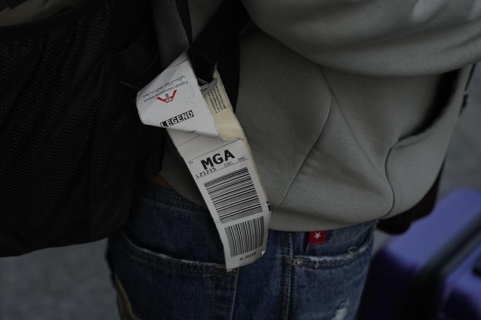 A baggage tag is seen on the bag of an Indian passenger who travelled in an unmarked Legend Airlines A340 from Vatry Airport in France and arrived at the Chhatrapati Shivaji Maharaj International Airport in Mumbai, India, Tuesday, Dec. 26, 2023. A charter plane that was grounded in France for a human trafficking investigation arrived in India with 276 Indians aboard early Tuesday, authorities said. The passengers had been heading to Nicaragua but were instead blocked inside the Vatry Airport for four days in an exceptional holiday ordeal. (AP Photo/Rafiq Maqbool)