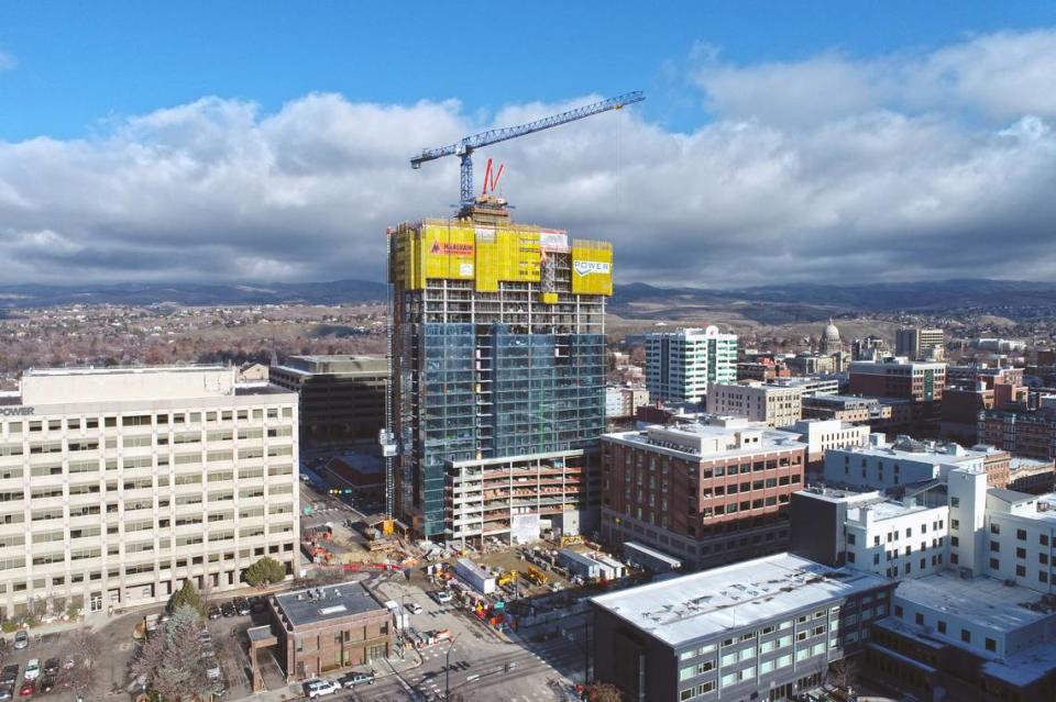 The 26-story 12th and Idaho building, recently named The Arthur, finished vertical construction in early February and is slated to open in early 2025. The Idaho Power building is to its immediate left. The state Capitol is in the background at right.