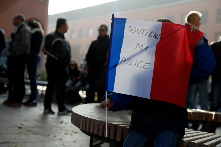 A sign reading "Support my police" as officers gather in the Paris suburbs during a protest on October 22, 2016