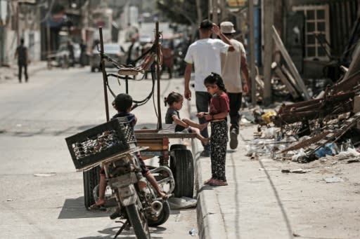 Palestinian refugee children play in a street of the Al-Shati refugee camp in Gaza City on September 1, 2018