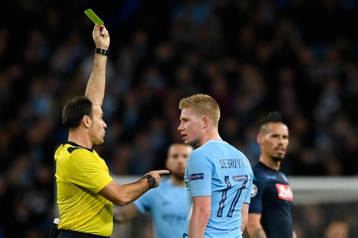 Seeing yellow: De Bruyne is booked for a display of dissent: Getty Images