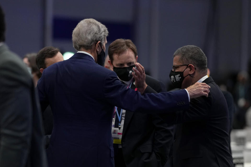 John Kerry, left, United States Special Presidential Envoy for Climate talks with Alok Sharma, right, President of the COP26 during a stocktaking plenary at the COP26 U.N. Climate Summit, in Glasgow, Scotland, Saturday, Nov. 13, 2021. Going into overtime, negotiators at U.N. climate talks in Glasgow are still trying to find common ground on phasing out coal, when nations need to update their emission-cutting pledges and, especially, on money. (AP Photo/Alastair Grant)