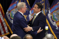 New York Gov. Andrew Cuomo, right, talks with former Vice President Al Gore after signing the Climate Leadership and Community Protection Act at Fordham University in New York, Thursday, July 18, 2019. (AP Photo/Richard Drew)