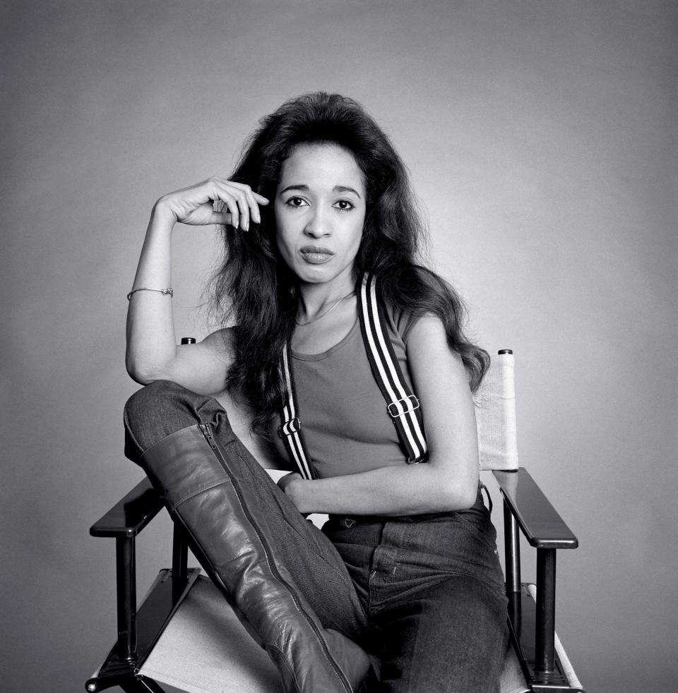 Ronnie Spector sitting in a chair