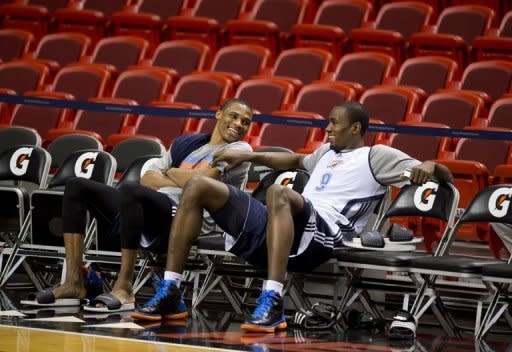 Oklahoma City Thunder players Russell Westbrook (L) and Serge Ibaka attend a practice at the American Airlines Arena in Miami, Florida. The Heat and the Oklahoma City Thunder are preparing for Game 5 of their NBA Finals scheduled for June 21