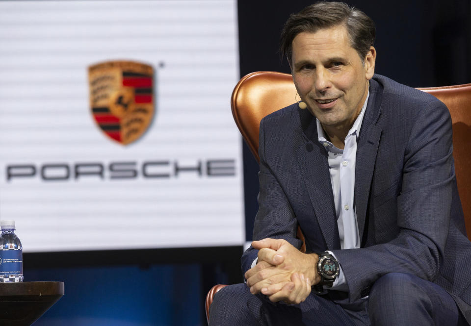 Klaus Zellmer, president and CEO Porsche Cars North America, smiles during a panel called "Racing The Future: How Porsche Sees The Road Ahead," at the AutoMobility LA Auto Show in Los Angeles, Tuesday, Nov. 19, 2019. (AP Photo/Damian Dovarganes)