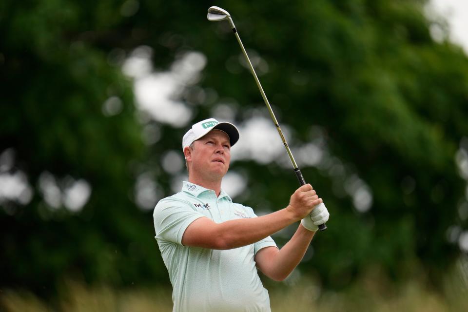 MJ Daffue, of South Africa, watches his shot on the sixth hole (AP)