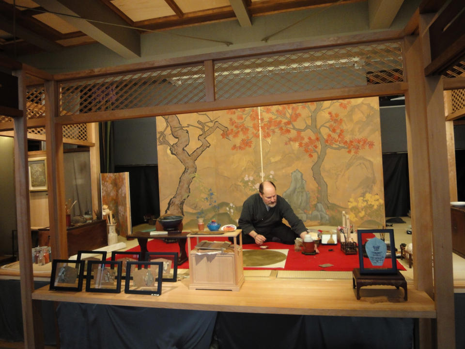 This Oct. 29, 2013 photo shows artist Allan West in his studio in the Yanaka neighborhood of Tokyo. Only nine stores remain in Japan that sell the traditional pigments West paints with, four of which are in Yanaka. (AP Photo/Linda Lombardi)