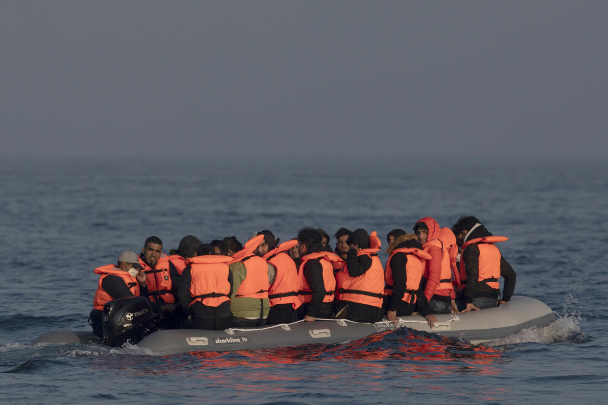 AT SEA, ENGLAND - JULY 22: An inflatable craft carrying migrant men, women and children crosses the shipping lane in the English Channel on July 22, 2021 off the coast of Dover, England. On Monday, 430 migrants crossed the channel from France, a record for a single day. To stem the rising numbers, the British and French governments announced yesterday a deal under which the UK will pay over £54 million and France will double the number of police patrolling the beaches from which migrants launch their boats. (Photo by Dan Kitwood/Getty Images)