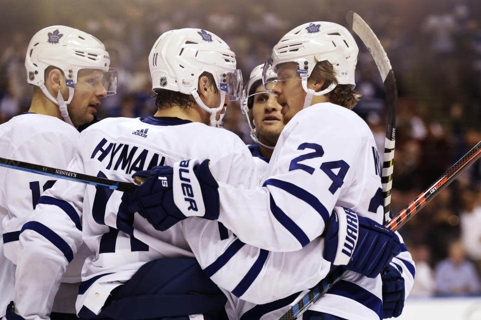 Toronto Maple Leafs right wing Kasperi Kapanen (24) is congratulated after his goal during the first period of the team's NHL hockey game against the Florida Panthers, Thursday, Feb. 27, 2020, in Sunrise, Fla. (AP Photo/Wilfredo Lee)