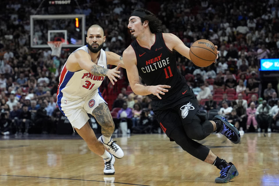 Miami Heat guard Jaime Jaquez Jr. (11) drives against Detroit Pistons guard Evan Fournier (31) during the first half of an NBA basketball game Tuesday, March 5, 2024, in Miami. (AP Photo/Lynne Sladky)