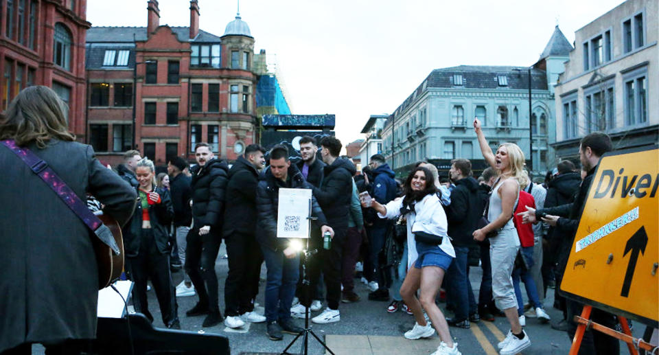 A group of young people in Manchester's city centre party in the street thanks to an easing of restrictions.