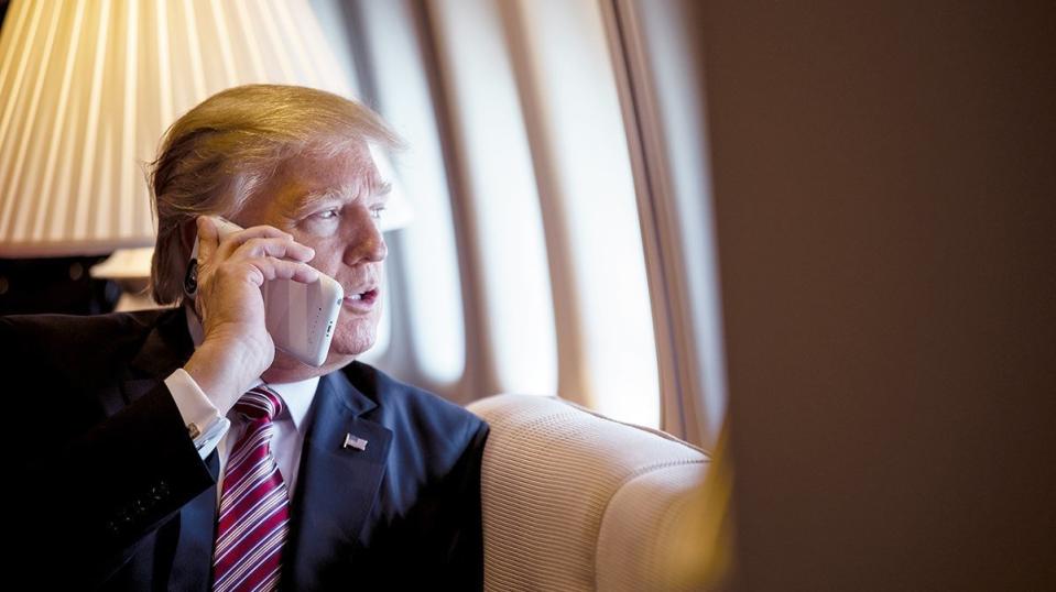 President Donald Trump uses a cellphone not equipped with top security