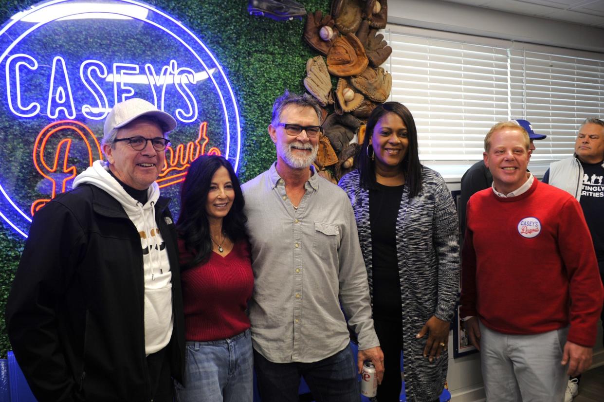 Former Evansville mayor Lloyd Winneke, Lori and Don Mattingly, mayor Stephanie Terry and Casey Keown pose before the ribbon cutting at Casey's Dugout on Saturday, March 10, 2024.