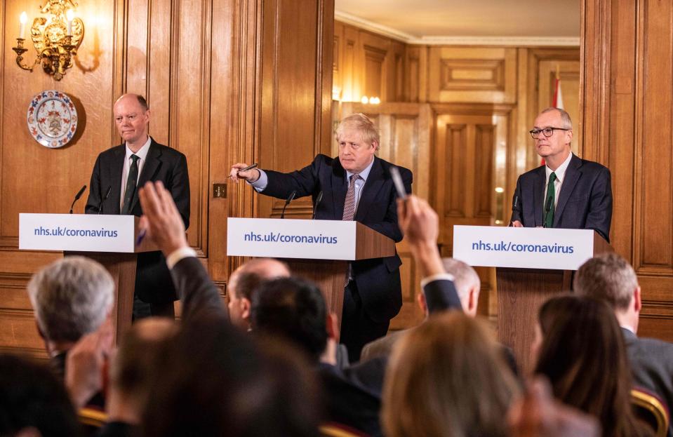 Prime Minister Boris Johnson gives a press conference on the ongoing COVID-19 situation with chief medical officer Chris Whitty (L) and Chief scientific officer Sir Patrick Vallance, in London on March 16, 2020. (Photo by Richard Pohle / POOL / AFP) (Photo by RICHARD POHLE/POOL/AFP via Getty Images)