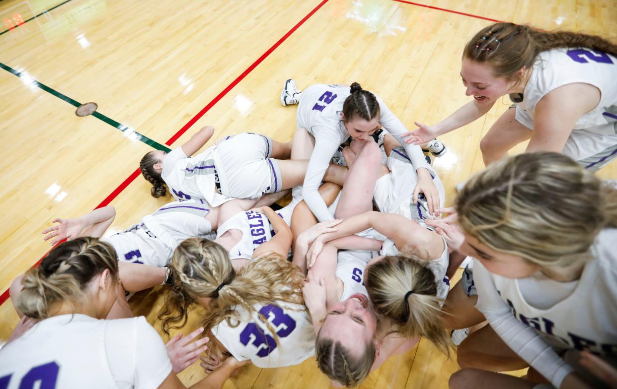 The Fair Grove Lady Eagles celebrate after they beat Strafford in the Class 3 District 11 championship at Springfield Catholic on Friday, Feb. 23, 2024.