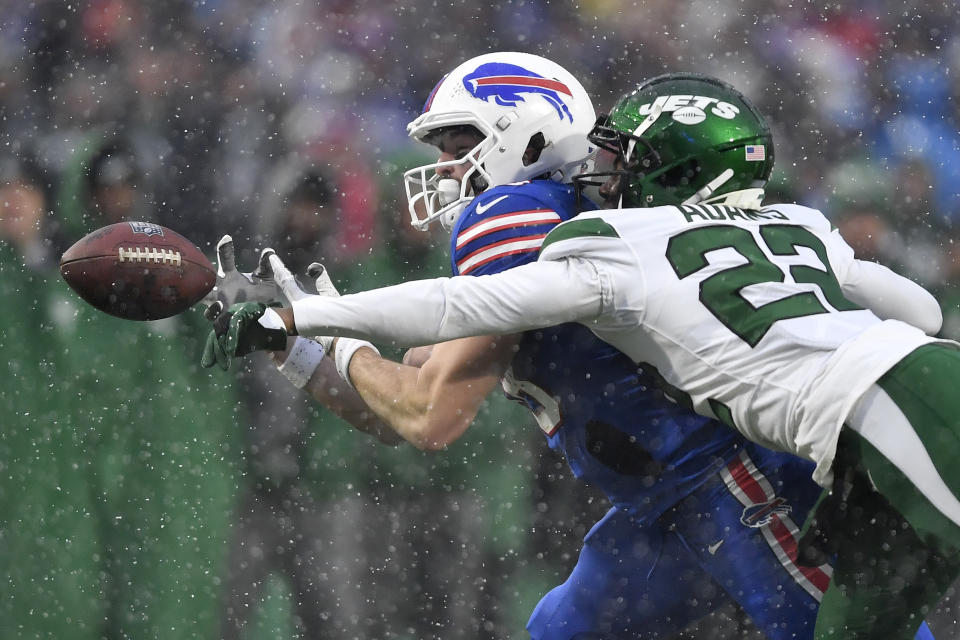 Buffalo Bills tight end Dawson Knox, left, is unable to make a catch as New York Jets safety Tony Adams (22) defends during the second half of an NFL football game, Sunday, Dec. 11, 2022, in Orchard Park, N.Y. (AP Photo/Adrian Kraus)