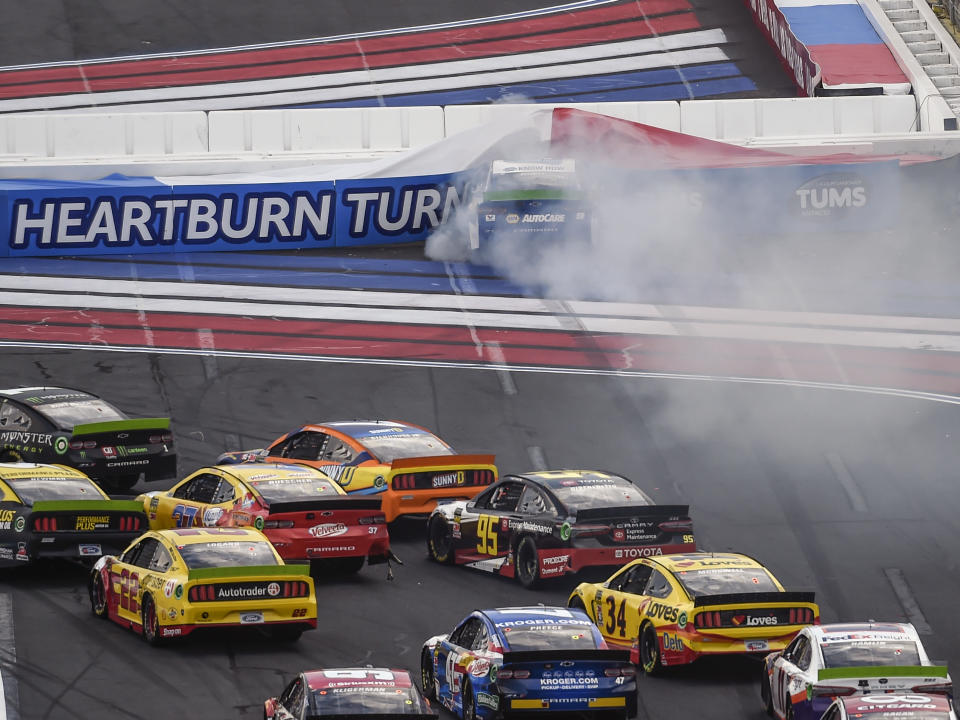 Chase Elliott (9) hits the wall in Turn 1 on a restart during a NASCAR Cup Series auto race at Charlotte Motor Speedway, Sunday, Sept. 29, 2019, in Concord, N.C. (AP Photo/Mike McCarn)