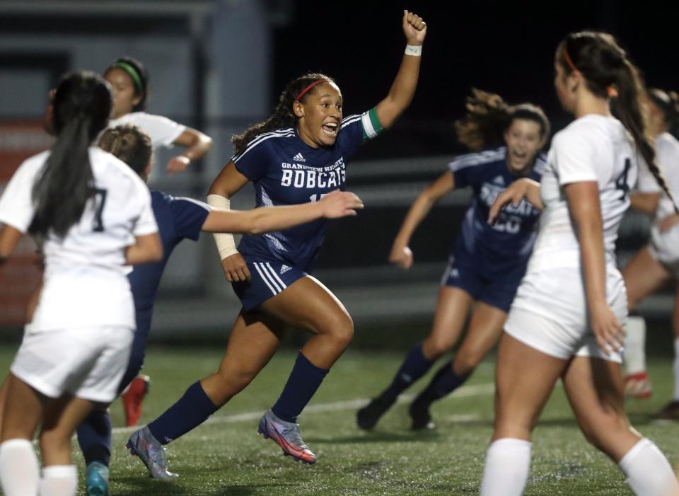 Grandview Heights' Natalie Smith celebrates after scoring on a late penalty kick for her second goal of the night to put the Bobcats up 3-2 in a Division III regional semifinal against Berlin Hiland on Nov. 1 at Westerville Central.