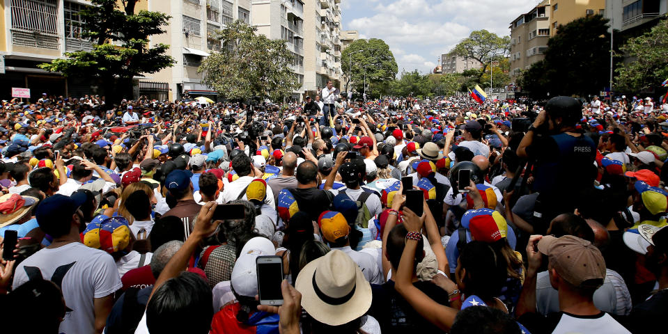 The leader of Venezuela's National Assembly Juan Guaido, who declared himself the country's interim president, speaks to supporters during a rally against the government of President Nicolas Maduro, in Caracas, Venezuela, Saturday, March 9, 2019. (AP Photo/Eduardo Verdugo)