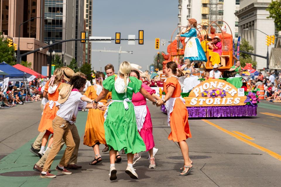 Parade participants with the float Pioneer Stories dance on the parade route during the annual Days of ’47 Parade in Salt Lake City on Monday, July 24, 2023. | Megan Nielsen, Deseret News