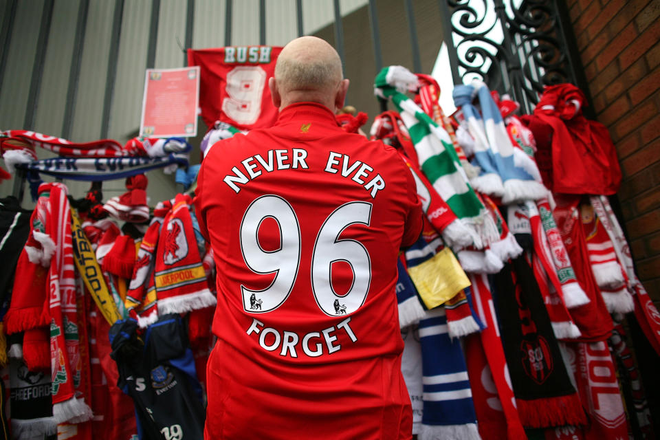 Liverpool fans pay their respects at the Hillsborough memorial at Anfield in 2009