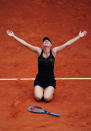 PARIS, FRANCE - JUNE 09: Maria Sharapova of Russia celebrates victory in the women's singles final against Sara Errani of Italy during day 14 of the French Open at Roland Garros on June 9, 2012 in Paris, France. (Photo by Mike Hewitt/Getty Images)