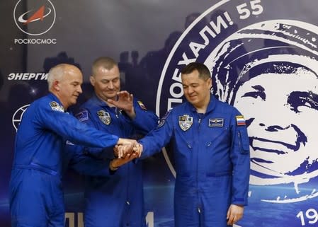 Members of the International Space Station (ISS) crew (L to R) Jeff Williams of the U.S., Alexey Ovchinin and Oleg Skriprochka of Russia pose after a news conference behind a glass wall at the Baikonur cosmodrome, Kazakhstan, March 17, 2016, ahead of their launch scheduled on March 19. REUTERS/Shamil Zhumatov