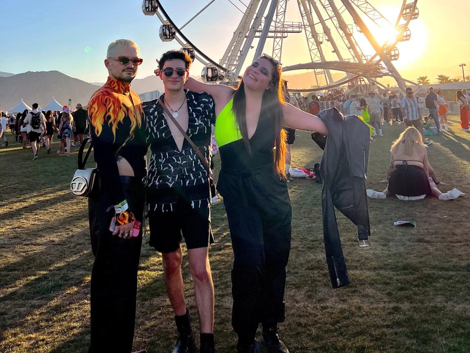 isabella rolz and friends posing in front of coachella ferris wheel