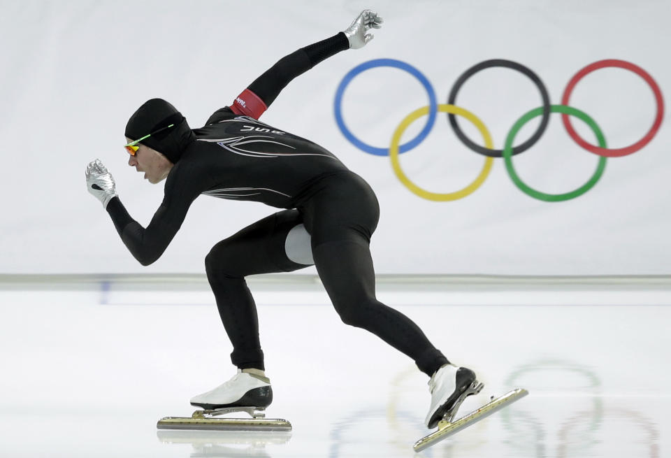 FILE - In this Monday, Feb. 10, 2014 file photo, Tucker Fredricks of the United States competes in the first heat of the men's 500-meter speedskating race at Adler Arena in Sochi, Russia, during the 2014 Winter Olympics. After a strong season on the World Cup circuit, the U.S. speedskating team has had a miserable performance the first week of the Sochi Olympics — and much of the speculation has turned to its new high-tech Under Armour skinsuit developed with help from aerospace and defense giant Lockheed Martin. (AP Photo/Patrick Semansky, File)