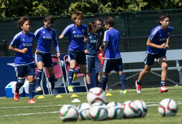 Members of Japan's national team warm up during a training session in Vancouver, British Columbia on July 4, 2015, on the eve of the 2015 FIFA Women's World Cup final