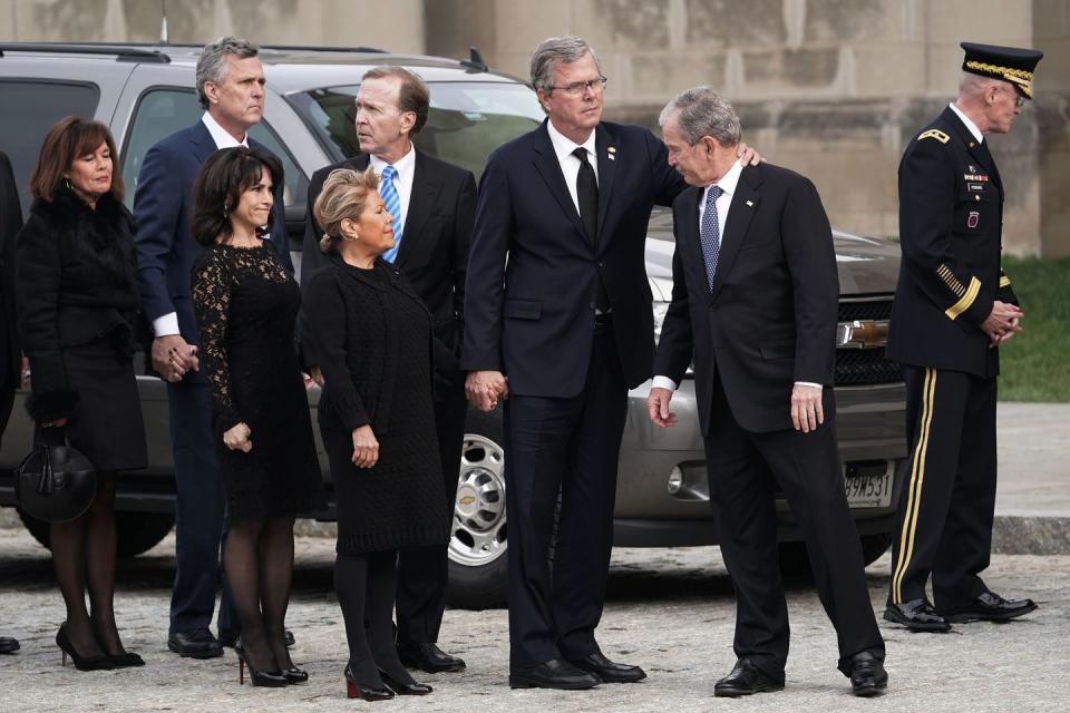 <p>The Bushes share a moment as they arrive at the state funeral being held for their father.</p>