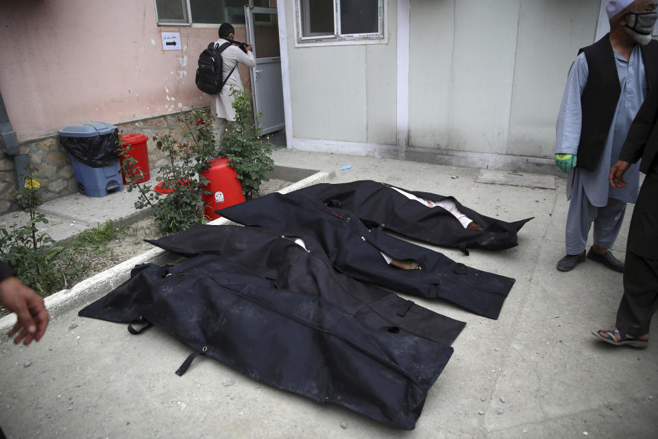 Bodies of people killed during an attack lie on the ground at a maternity hospital in Kabul, Afghanistan, Tuesday, May 12, 2020. Militants stormed a maternity hospital in the western part of Kabul on Tuesday, setting off an hours-long shootout with the police and killing over a dozen people, including two newborn babies, their mothers and an unspecified number of nurses (AP Photo/Rahmat Gul)