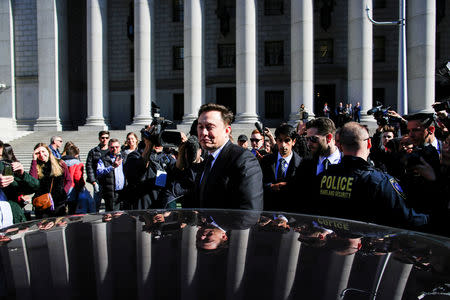 FILE PHOTO: Tesla Inc CEO Elon Musk (C) exits after attending a SEC. hearing at the Manhattan Federal Courthouse in New York, April 4, 2019. REUTERS/Eduardo Munoz/File Photo