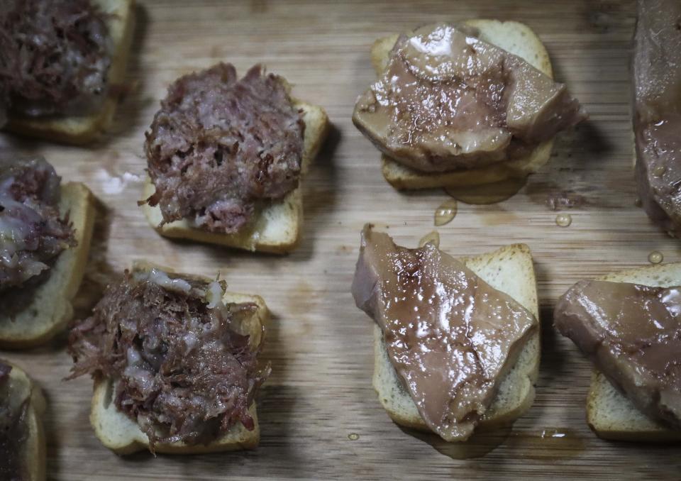 CORRECTS TO HUDSON VALLEY FOIE GRAS INSTEAD OF HIDDEN VALLEY FOIE GRAS This July 18, 2019 photo, shows samples of foie gras delicacy from ducks farmed at Hudson Valley Foie Gras duck farm in Ferndale, N.Y. A New York City proposal to ban the sale of foie gras, the fattened liver of a duck or goose, has the backing of animal welfare advocates, but could mean trouble for farms outside the city that are the premier U.S. producers of the French delicacy. (AP Photo/Bebeto Matthews)
