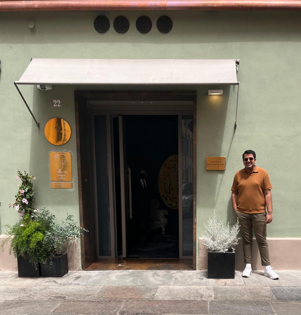 The writer next to  Osteria Francescana entrance