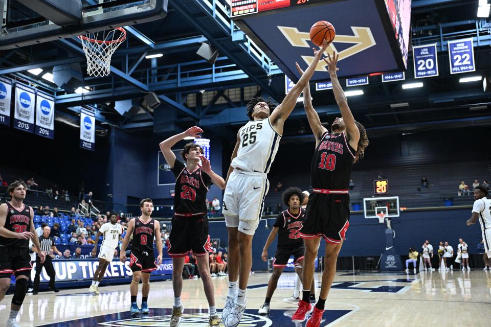 Akron Zips forward Enrique Freeman grabs a rebound against Miami-Hamilton on Dec. 17, 2023.