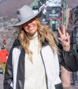 <p>Kelly Bensimon flashes a peace sign at Gondola Plaza while out and about in Aspen on Dec. 20. </p>