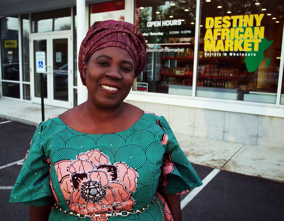 Owner and founder Sola Ajao, who is originally from Nigeria, stands outside Destiny African Market in Randolph on Nov. 2, 2021.