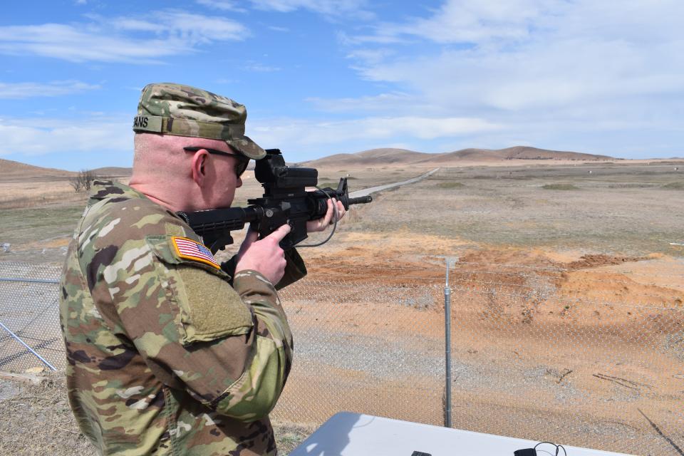 A Wisconsin National Guardsman takes aim with a Smart Shooter.
