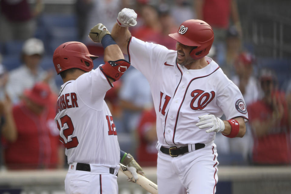 Washington Nationals' Ryan Zimmerman, right, celebrates his three-run home run with Kyle Schwarber during the fourth inning of a baseball game against the Baltimore Orioles, Saturday, May 22, 2021, in Washington. (AP Photo/Nick Wass)