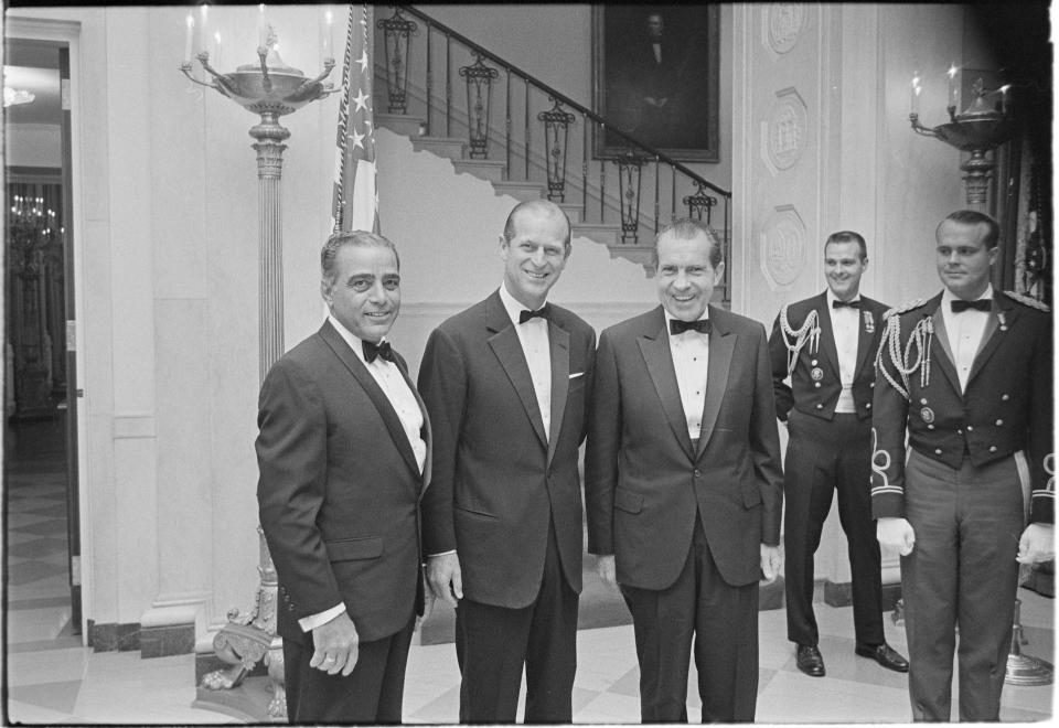 <p>President Richard Nixon, stands with Prince Philip, second from left, prior to a black tie state dinner.</p> (The Richard Nixon Library & Museum via AP)