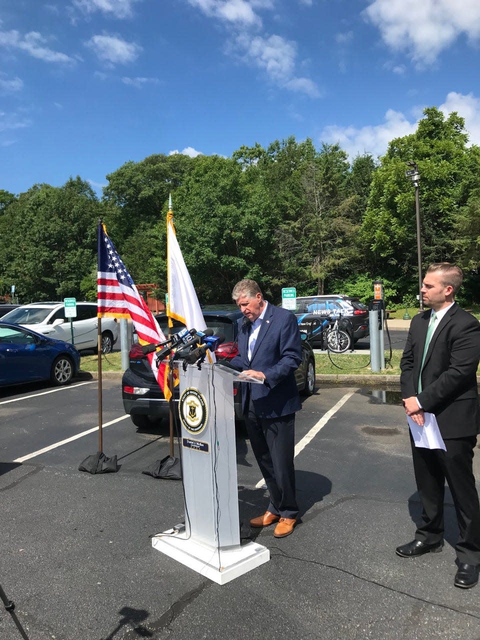 Gov. Dan McKee kicked off his #RIMomentum tour Tuesday by promoting the state's new electric-vehicle rebate program.